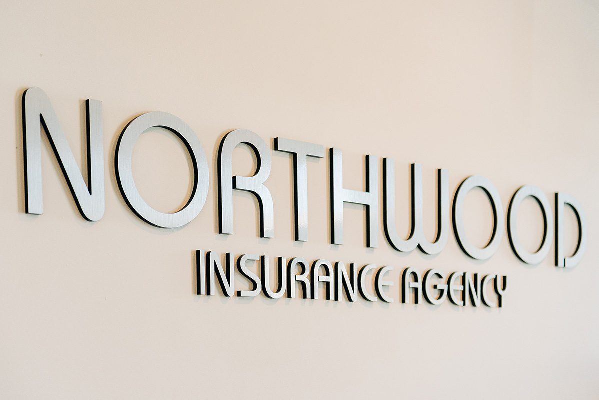 About Our Agency - Northwood Insurance Agency Logo Decal on a Wall Inside the Office